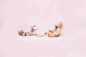PLEASEPINCHMEHARD rich results for free short erotic stories image shows woman tied up on all fours with a teddy behind her