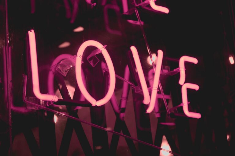 pleasepinchmehard photo from Unsplash of neon lights with the word love