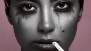 photo of a woman with smudged mascara and a cigarette after having messy sex pleasepinchmehard lisa opel